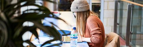 Female Azerbaijan student studying in library
