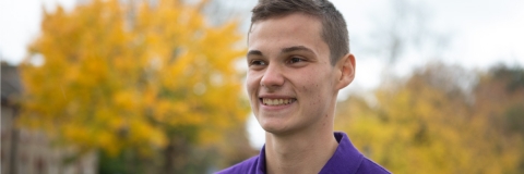 Smiling male student at open day