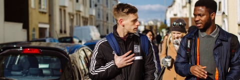 2 male international students chatting in Southsea street
