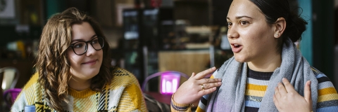 Two students in discussion outside