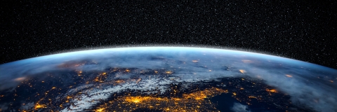 Close up of the earth from space at night with street lights visible