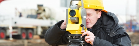 Student using surveying equipment