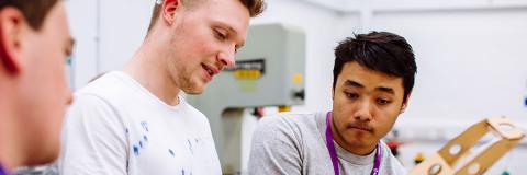 American Students discussing wooden model