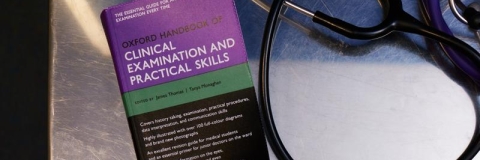 clinical health book and stethoscope
