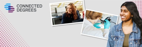 Student sitting smiling infront of another person talking