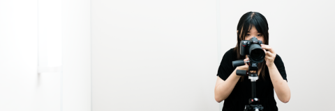 Student taking a photo with DSLR