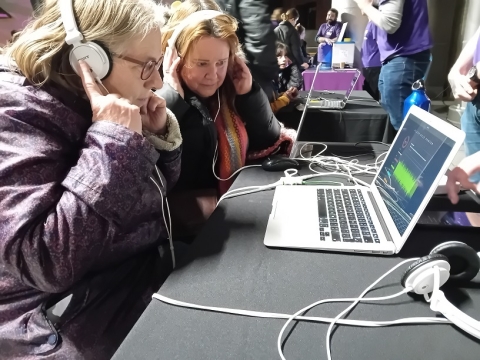 Two women taking part in Stargazing event