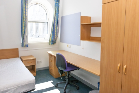 Room with bed and desk