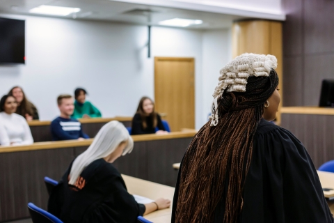 Students working in the replica courtroom
