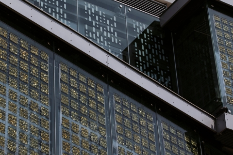  Close up of a building, with solar photovoltaic panels covering it