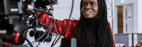 Student using film equipment