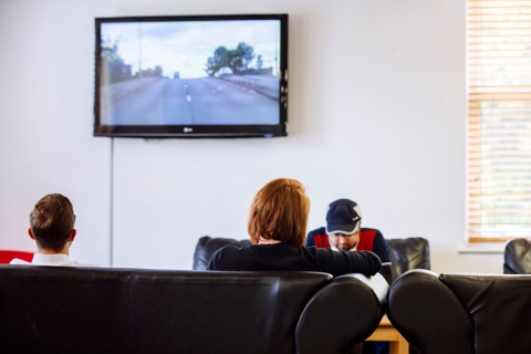 Students watching television in social space of Rees Hall, Portsmouth