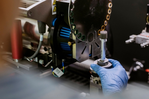 Student operating parts machinery in Technology Facilities