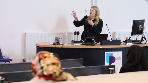 A student presenting in a lecture theatre