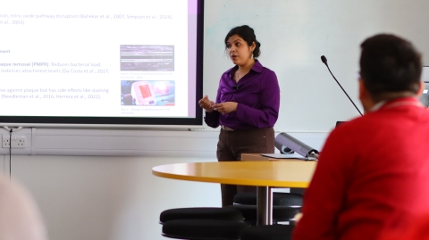 A student presenting in a lecture theatre