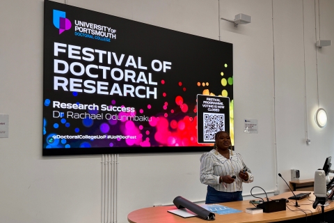 Photo of a student presenting in a lecture theatre