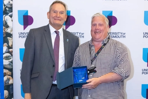 Headshot of Rob Isherwood with Vice Chancellor smiling
