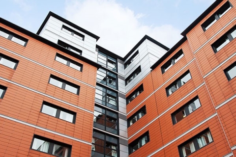 Exterior Rosalind Franklin student halls showing terracotta coloured panels from ground level