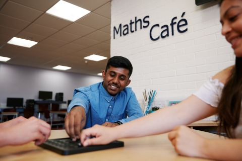 Three students in the maths cafe