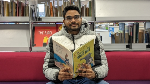 Student Santosh reading from book 'Seahorses Are Sold Out'