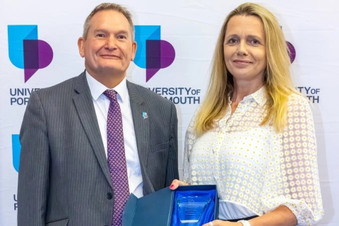 Headshot of Sarah Charman with the vice chancellor smiling