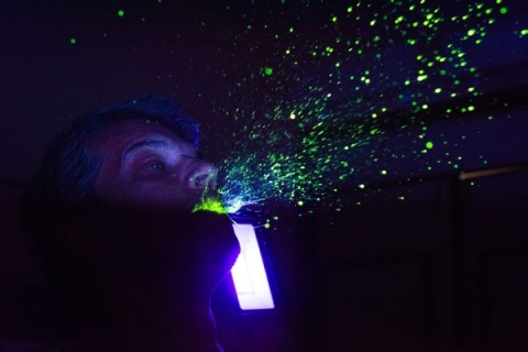 Man sneezing yellow dye