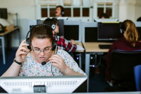 female student speaking headset microphone