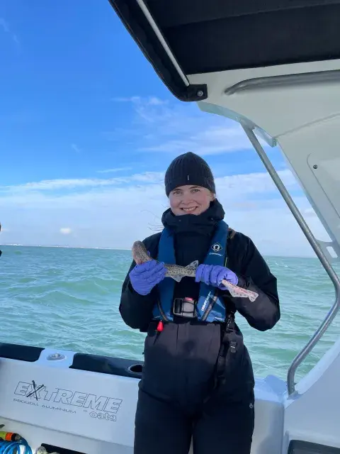 A member of the CAST team with a dogfish