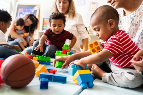 Children playing with toy bricks