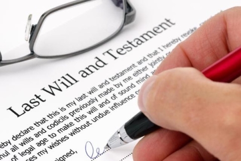 Someone signing a last will and testament