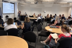 Classroom of people listening to a presentation