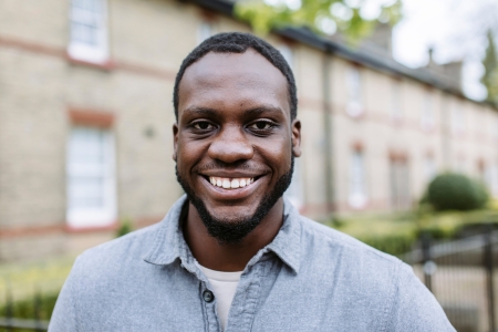 Headshot of male student stood outside of Milldam building