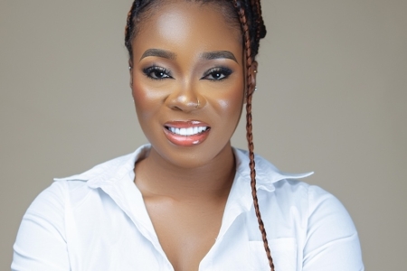 Jenny smiling at the camera against a plain background