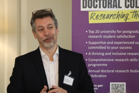 Photo of Darren Van Laar giving a talk to students