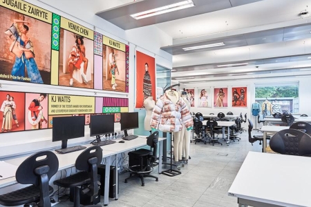 Fashion and Textile Design teaching and learning space featuring desks, chairs, computers, student work and posters