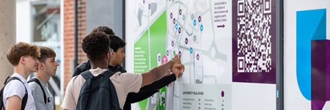 Students looking at a campus map