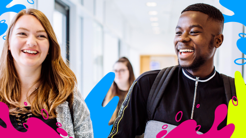 Two smiling students hold a backpack, showcasing a moment of friendship